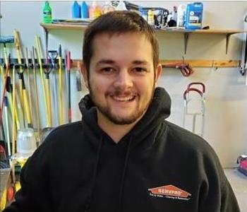 man posing black servpro shirt beard