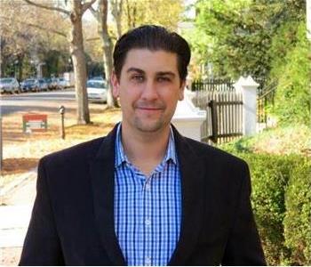 male posing, black jacket, blue shirt