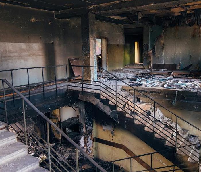 Soot and fire damage in a large building on a stairwell