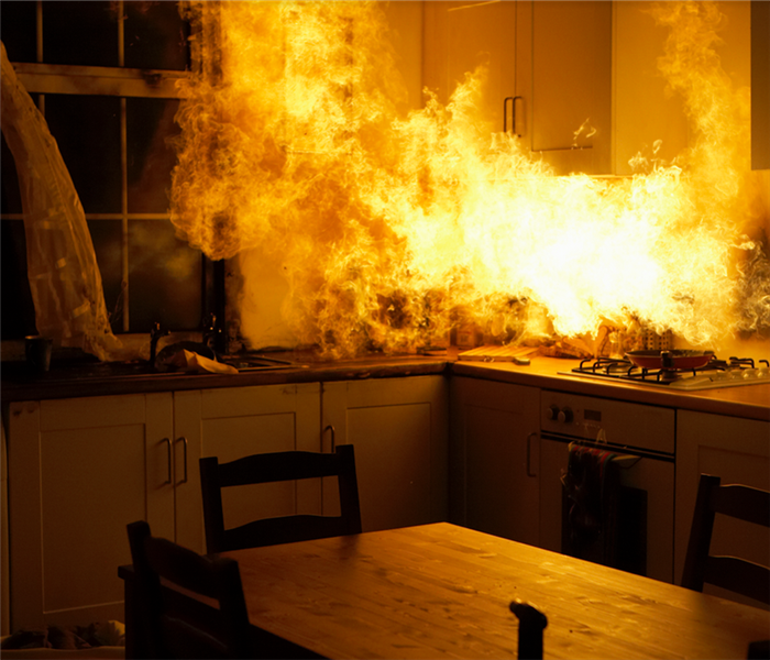 a kitchen in a house on fire