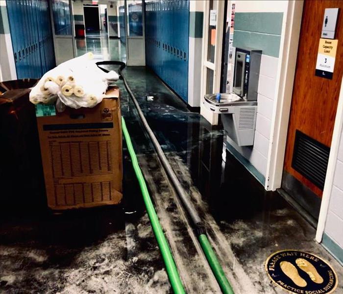 school flooded with muck